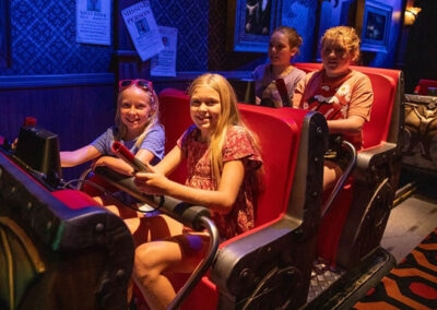 Four youth entering the Whispering Pines Haunted Hotel Dark Ride at Funtown USA